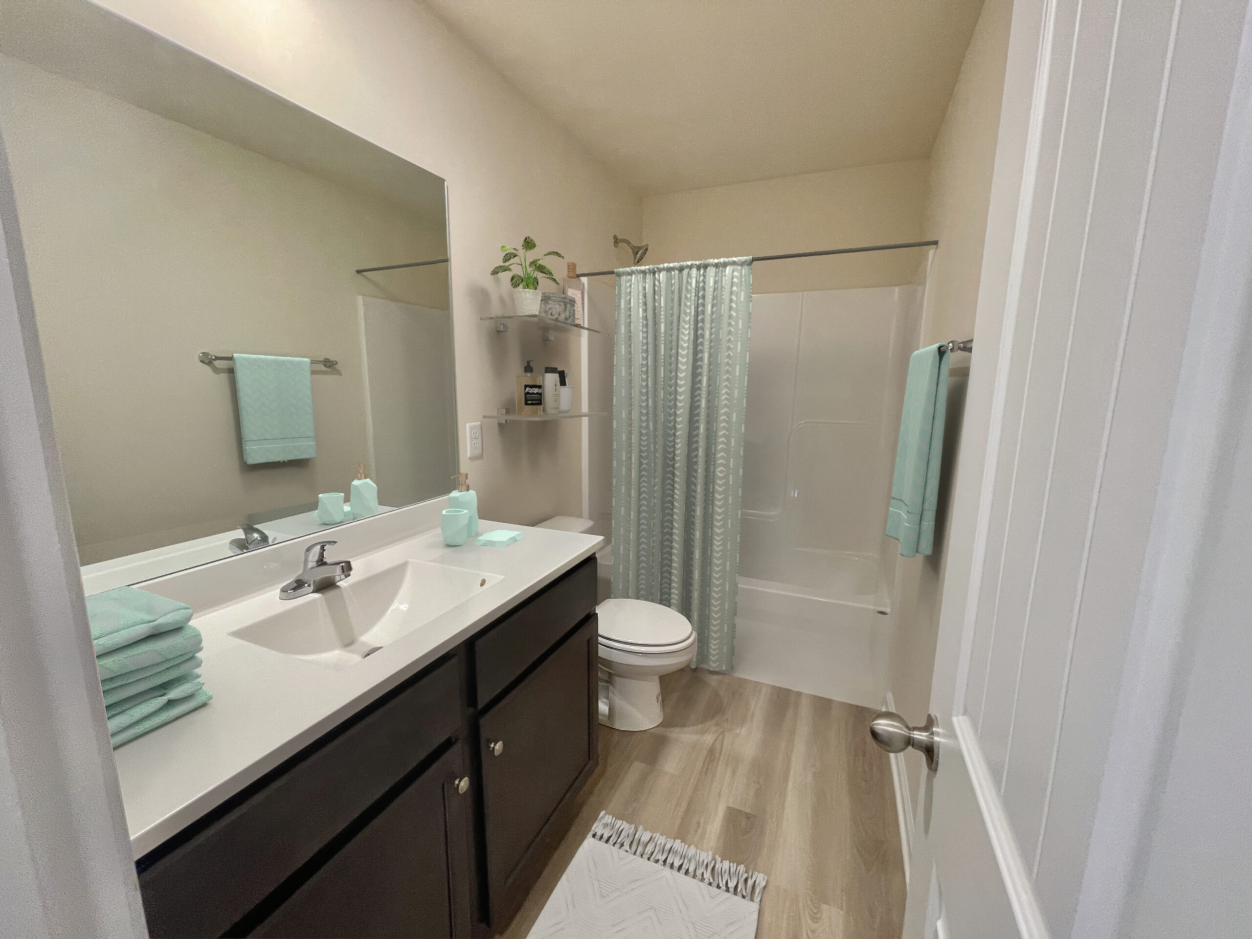 1693405206271135906_willow_16_5_full_hall_bath__1_ Photo of the Owner's Suite at the Elmsted model in Castleton by Boyd Homes showing vaulted ceiling and huge open space