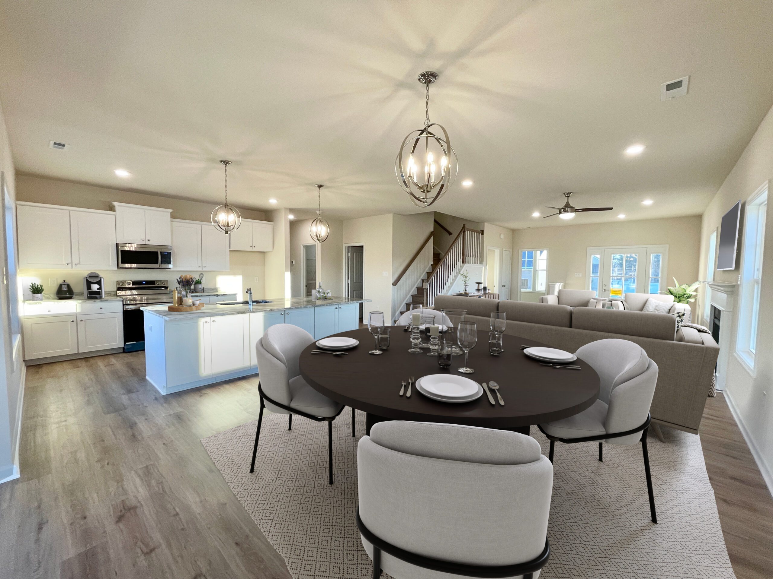 Castleton-46-6-juniper-kitchen-dining-livingroompg Photo of the furnished dining room and kitchen inside the Juniper Lot 46 Section 6 Castleton in Henrico VA