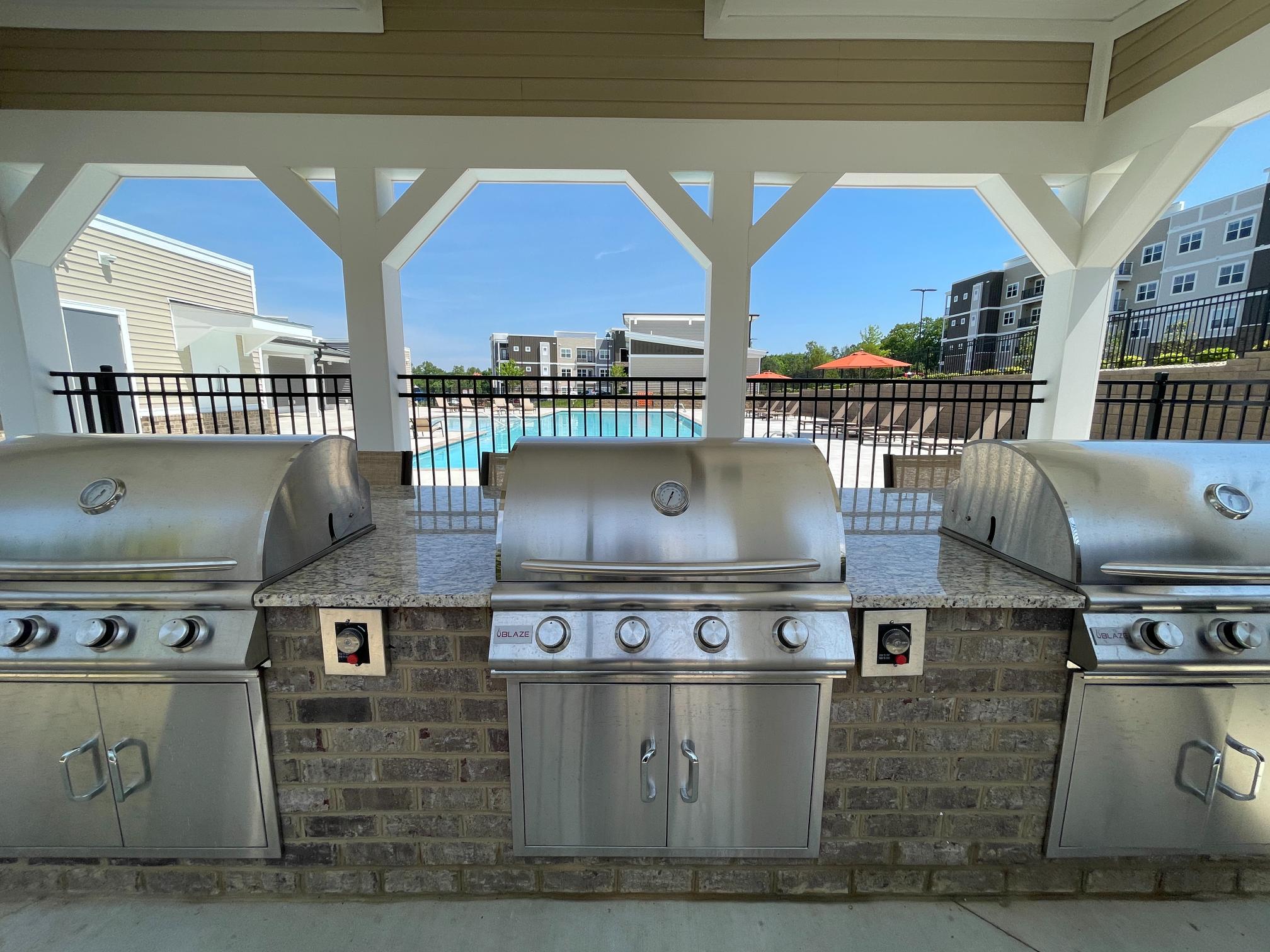 MAG-covered-grills Nexus Luxury Apartments saltwater pool with water lounge